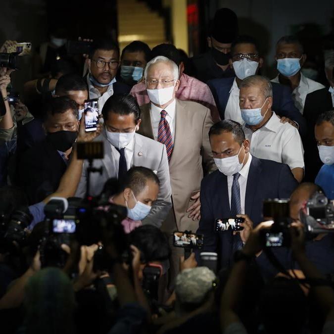 Malaysia halves prison term for ex-Prime Minister who oversaw multibillion-dollar 1MDB thefts